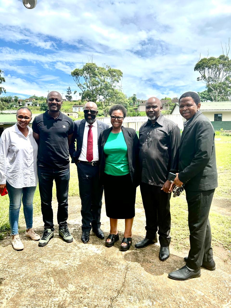 T.D Foundation team at uMgababa Primary School, engaging directly with the school principal in support of education promotion initiative.